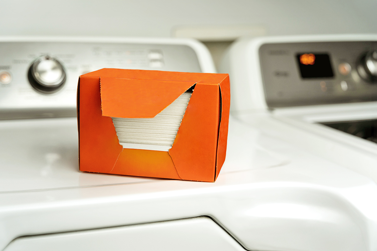 Dryer sheets sitting on top a washing machine