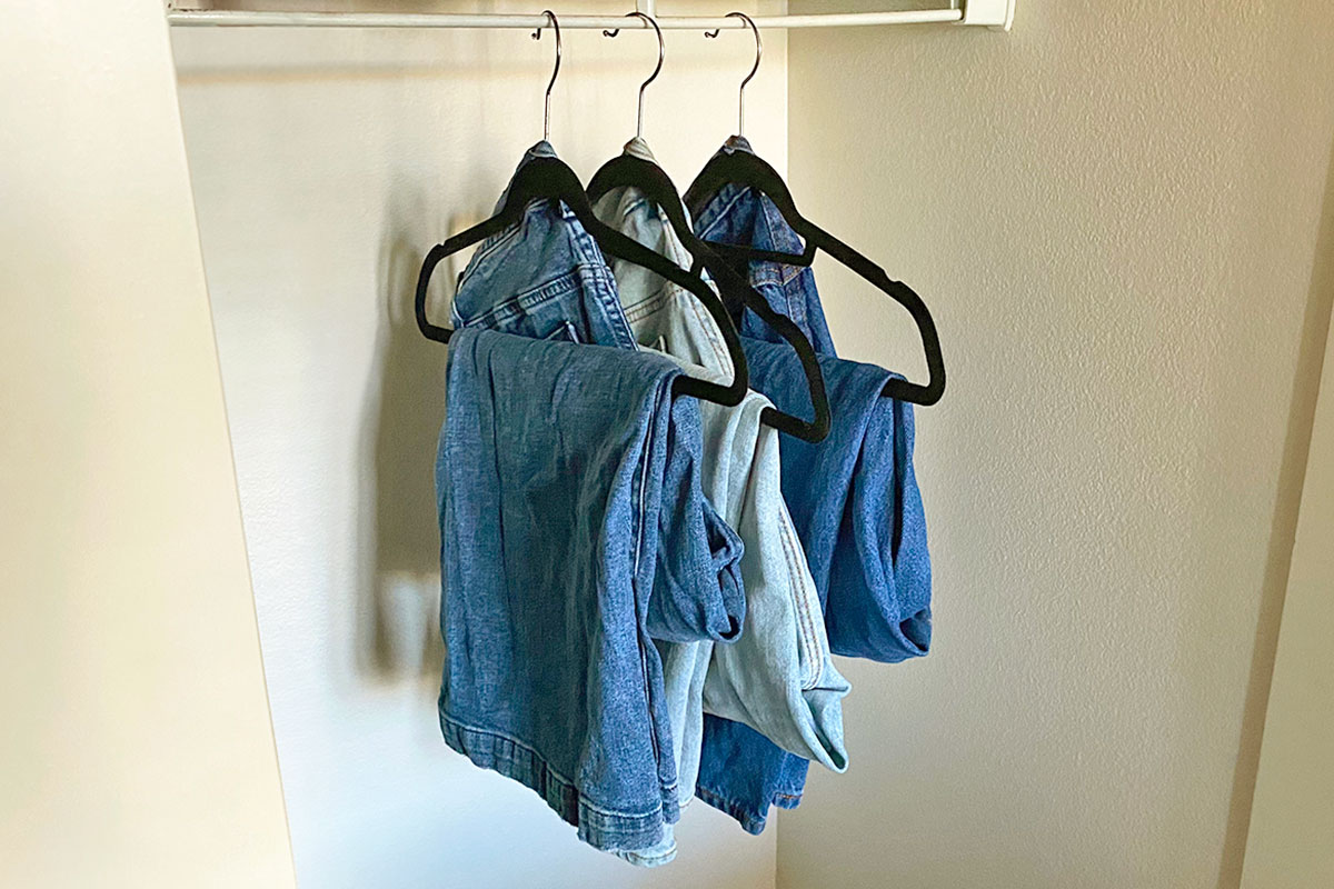 Jeans hanging in a closet