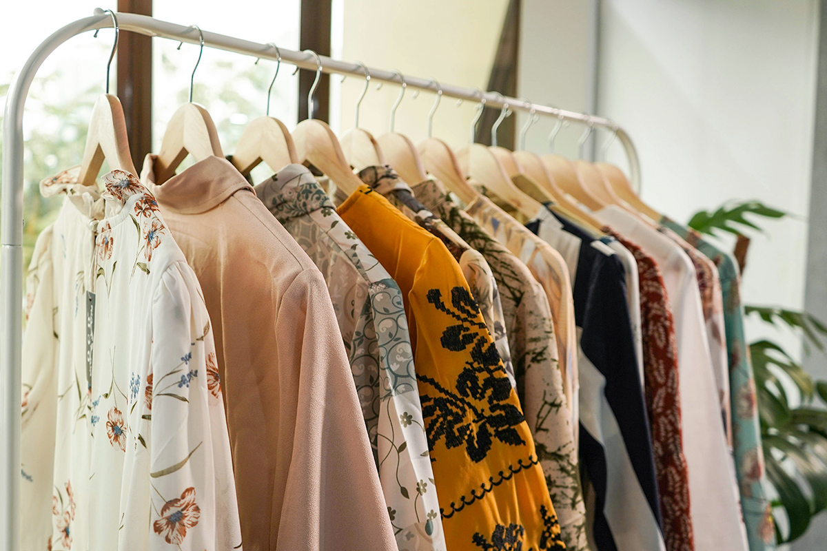 Clothing rack filled with tops on hangers